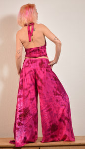 Summer Palazzo pants. Buy online from Emma's Emporium wholesale women's festival, alternative and hippie clothing. Multicoloured rainbow tie dye PALAZZO genie harem loose summer trousers. Shop now at Emma's Emporium UK clothing retail.