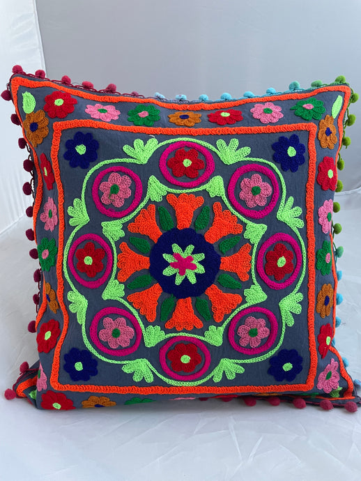 Available to buy online now from Emma's Emporium! Rainbow mandala embroidered Cushion Covers. Brightly coloured embroidery on a cotton background, with pom pom's. Extra large bold and eye catching cushion covers for a boho home. Visit Emma's Emporium for alternative women's clothing, festival fashion and hippy styles.