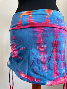 Emma's Emporium cotton lycra tie dye summer mini skirt, super colourful hippie tie dye asymmetric drawstring mini skirt, ideal for festival days and all night raves. Available to buy online from Emma's Emporium.