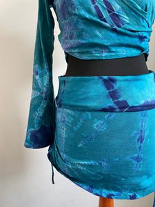 Emma's Emporium cotton lycra tie dye summer mini skirt, super colourful hippie tie dye asymmetric drawstring mini skirt, ideal for festival days and all night raves. Available to buy online from Emma's Emporium.