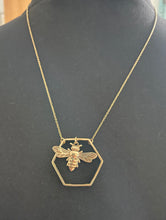 Load image into Gallery viewer, Emma&#39;s Emporium Brass jewellery, now available to buy online. Hippie Boho unique ethnic and tribal brass and silver plate jewellery. Beautiful little bee in a hexagon necklace, available in brass or silver plate.
