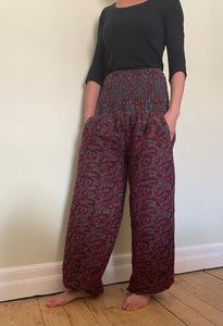 Emma's Emporium fleece genie harem trousers, loose fit warm winter  hippy pants, made from machine washable vegan fleece, in bright paisley design. Slow fashion, ethically sourced hippie festival hippy fashion.