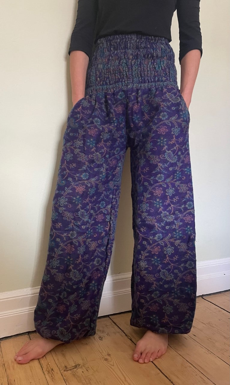 Emma's Emporium fleece genie harem trousers, loose fit warm winter  hippy pants, made from machine washable vegan fleece, in bright paisley design. Slow fashion, ethically sourced hippie festival hippy fashion.