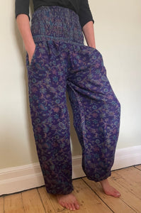 Emma's Emporium fleece genie harem trousers, loose fit warm winter  hippy pants, made from machine washable vegan fleece, in bright paisley design. Slow fashion, ethically sourced hippie festival hippy fashion.