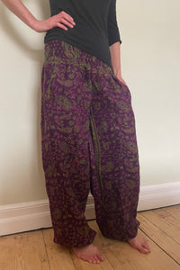 Emma's Emporium fleece genie harem trousers, loose fit warm winter  hippy pants, made from machine washable vegan fleece, in bright paisley design. Slow fashion, ethically sourced hippie festival hippy fashion.