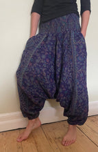 Load image into Gallery viewer, Emma&#39;s Emporium fleece genie harem trousers, loose fit warm winter  hippy pants, made from machine washable vegan fleece, in bright flower or paisley design. Slow fashion, ethically sourced hippie festival hippy fashion.
