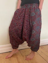 Load image into Gallery viewer, Emma&#39;s Emporium fleece genie harem trousers, loose fit warm winter  hippy pants, made from machine washable vegan fleece, in bright flower or paisley design. Slow fashion, ethically sourced hippie festival hippy fashion.
